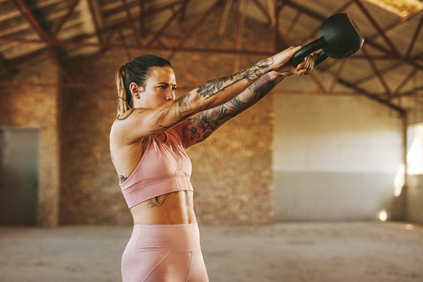 Woman Does Kettlebell Swings | kettlebell vs dumbbell