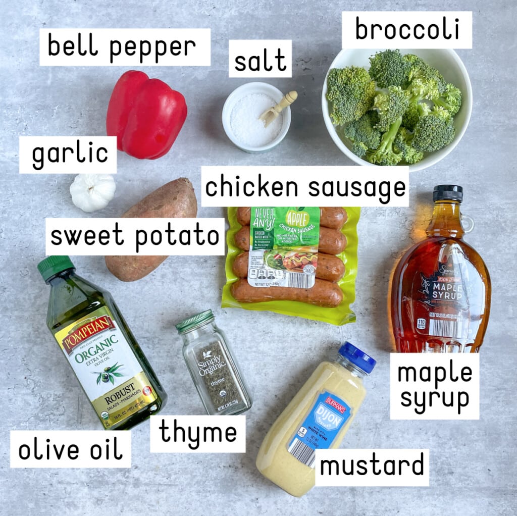 Ingredients for Sheet Pan Chicken Sausage & Veggies sit on a gray countertop.